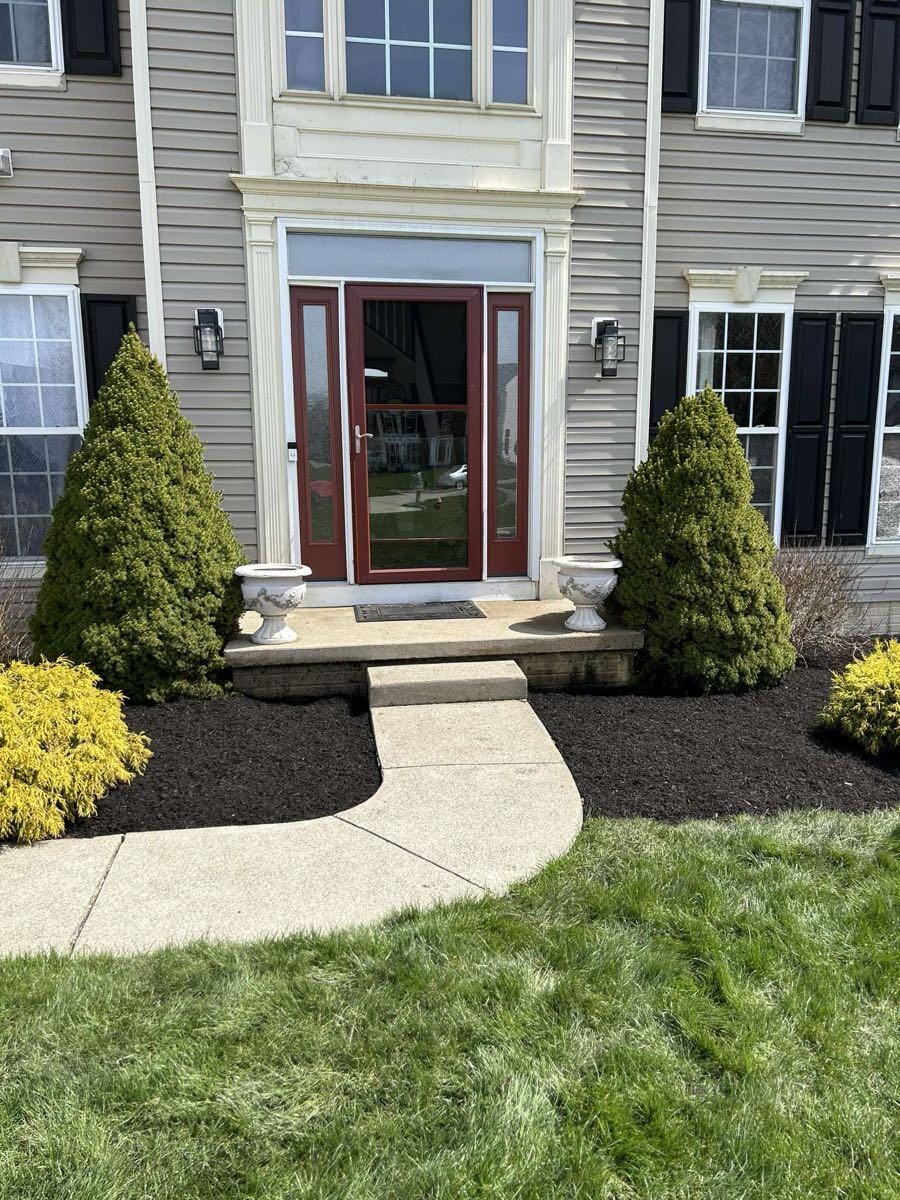 Front entry landscape beds after mulch installation